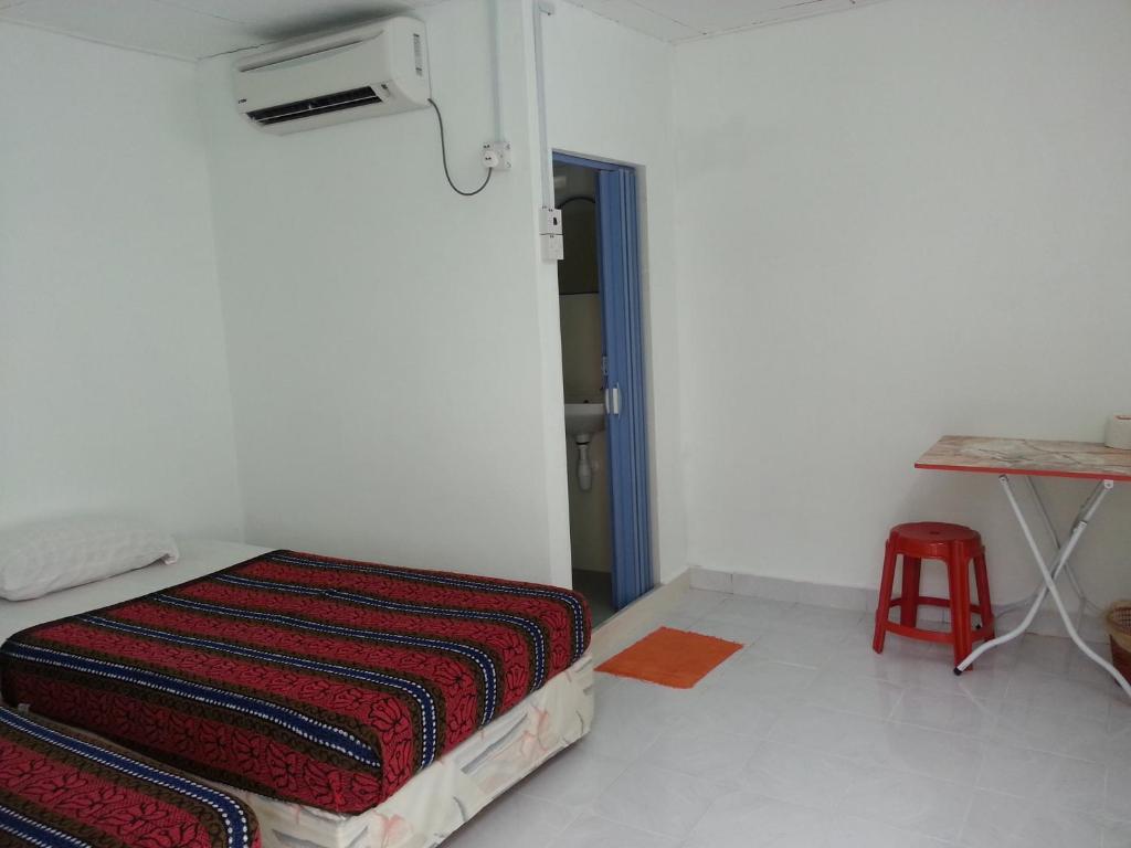 Et Budget Guest House Batu Feringgi Kamer foto