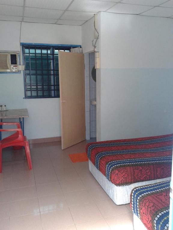 Et Budget Guest House Batu Feringgi Kamer foto